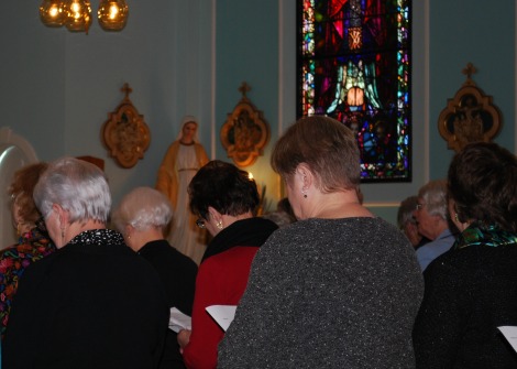 Members of the congregation bow their heads in prayer during the recent closing ceremony
